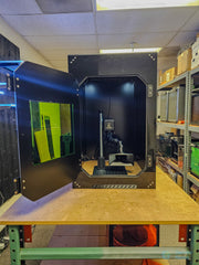 Reference build: Clearview ACM marking enclosure with door open showing 1064 nm laser-safety viewing window