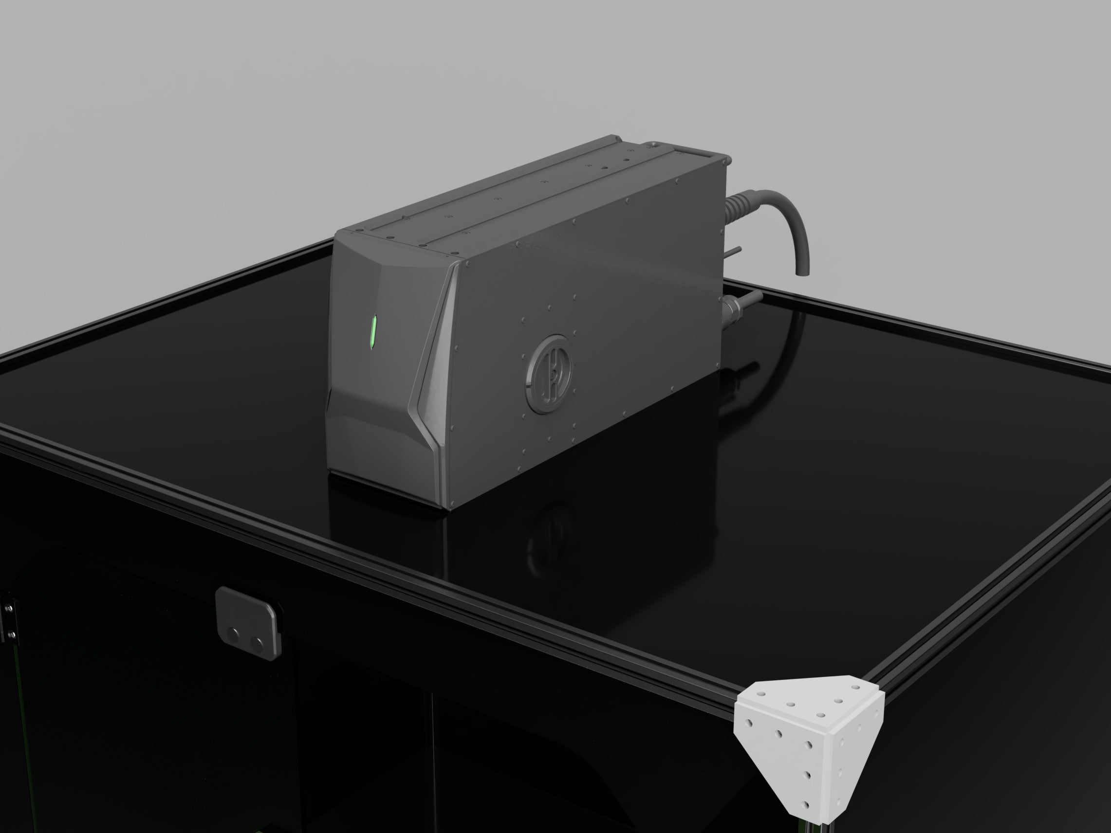 Render: Keyence MD-X marking head seated on the enclosure's top panel, marking down into the chamber, with cables routed off the back